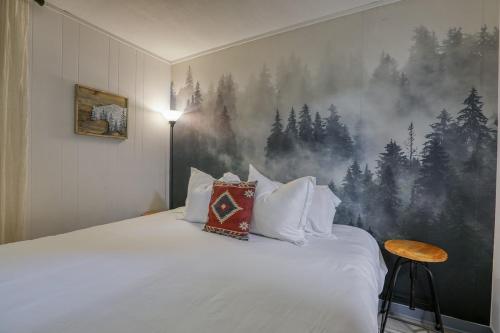 a bedroom with a bed with a forest mural on the wall at Bear Suite - King Bed Cabin Apartment in Gatlinburg
