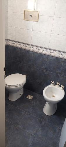 a bathroom with a toilet and a bidet at Hermosa casa, parrilla, aire libre, 8 personas in Buenos Aires