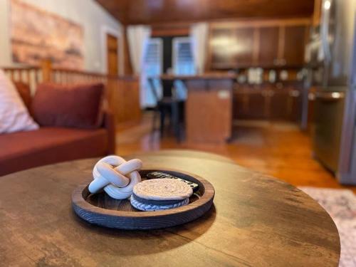 a table with a plate with sandals on top of it at The Log Haus An Countryside Escape in Pembroke