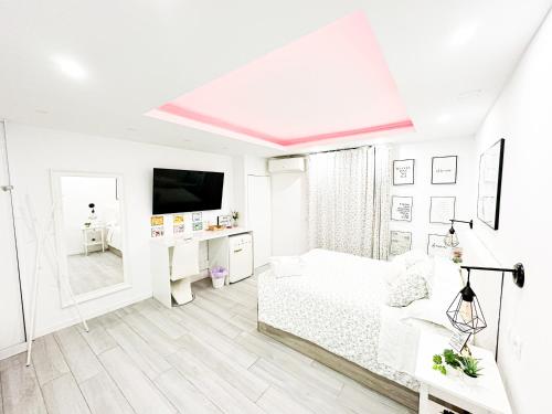 Postel nebo postele na pokoji v ubytování La Placita Boutique Centro