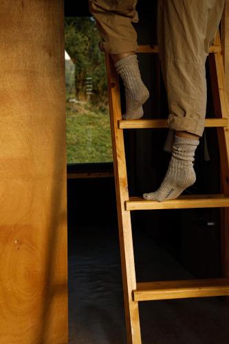 a person standing on the top of a ladder at Tranquil Tigín - your Little Holiday in Wicklow in Wicklow