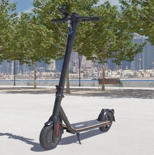 a scooter parked in a park next to a bench at Luxury apartment with 3 pools in Cabo Negro