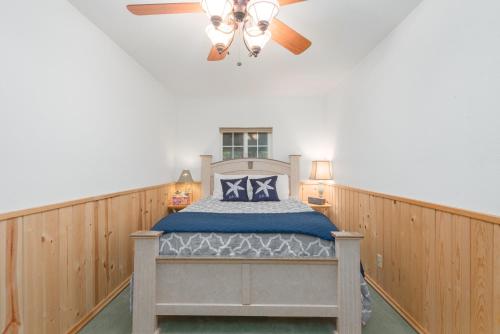 a bedroom with a bed and a ceiling fan at Hope's Hideaway, LLC in Hope
