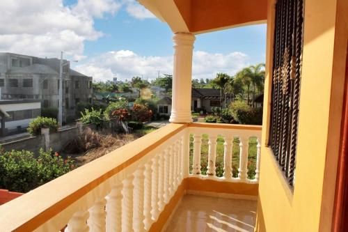 a balcony with a view of the city at Elegant Villa in Nagua with Private Pool and Jacuzzi in Nagua