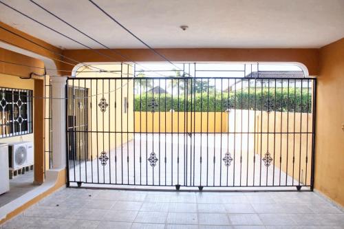 a large gate in a room with a patio at Elegant Villa in Nagua with Private Pool and Jacuzzi in Nagua