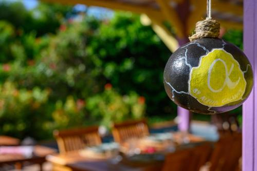a ball with an egg on it hanging over a table at Chez Marie & Philippe Ti'Kaz Vanille in Cadet