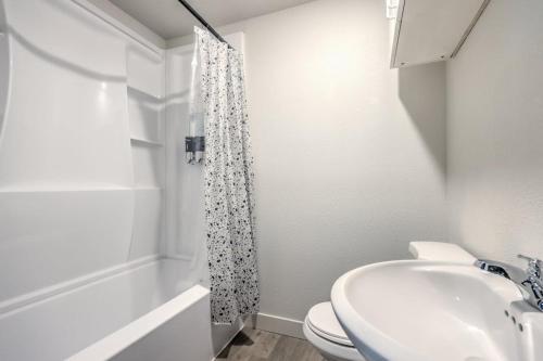 a bathroom with a sink and a toilet and a shower at Elegant Private Studio Sleeps 4! 10Min to Strip! in Las Vegas