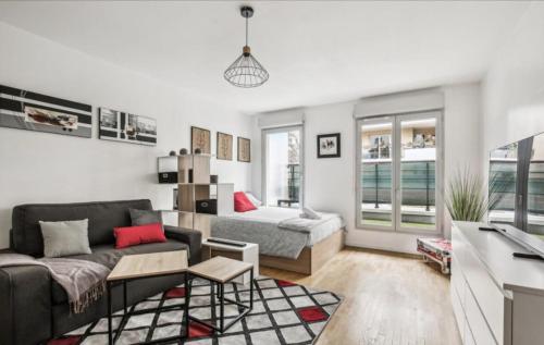 Χώρος καθιστικού στο Studio Lumineux et confortable parking