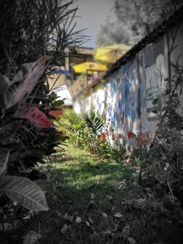 a building with graffiti on the side of it at Art & Coffee in Santa Cruz La Laguna