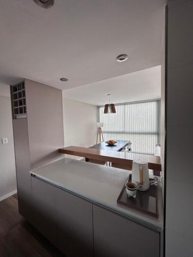 a kitchen with white walls and a counter top at Semipisos Balcarce in Balcarce