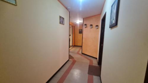 a hallway with a hallway at Hostal Montañes in La Paz
