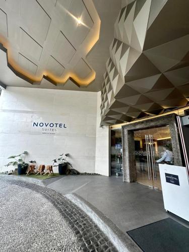 a view of a store with a sign on the wall at Novotel Hotel Residence Manila at Acqua in Manila
