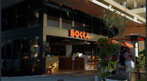 a building with a boks sign on the front of it at Azzure Escape in Kawana Waters