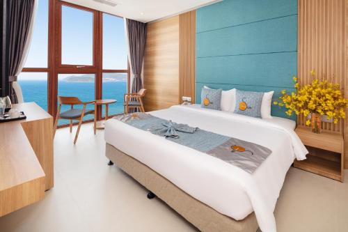 Postel nebo postele na pokoji v ubytování Sun Kiss Hotel