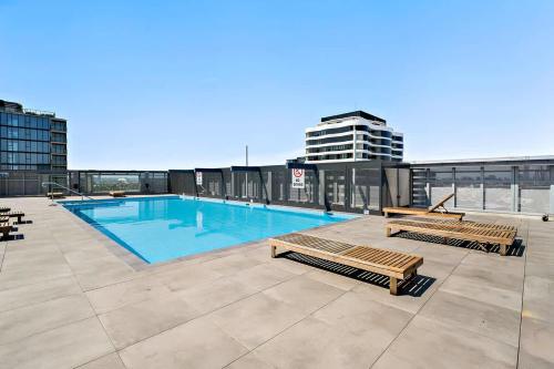 a swimming pool on the roof of a building at Riverina - Ultimate Footscray Getaway with parking in Melbourne