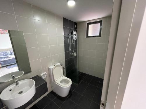 a bathroom with a sink and a toilet and a shower at MANIS EVO SoHo BANGI - WIFI, NETFLIX, SHOPPING MALL in Bandar Baru Bangi