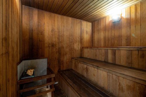 an empty wooden sauna with a light in it at LFlats Hotel Alameda Lorena Jardins in Sao Paulo