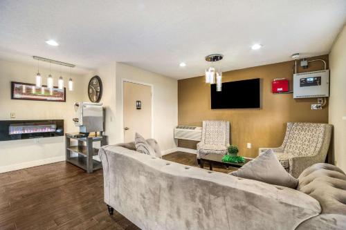 a living room with a couch and a tv at Quality Inn Columbia Airport in West Columbia
