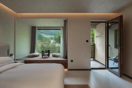 Afbeelding uit fotogalerij van 安吉简爱温泉酒店 in Hengbo