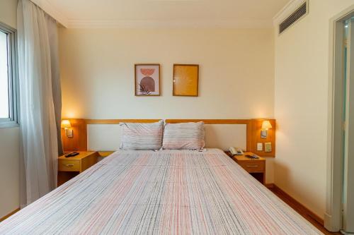 Ένα ή περισσότερα κρεβάτια σε δωμάτιο στο LFlats Hotel Oscar Freire