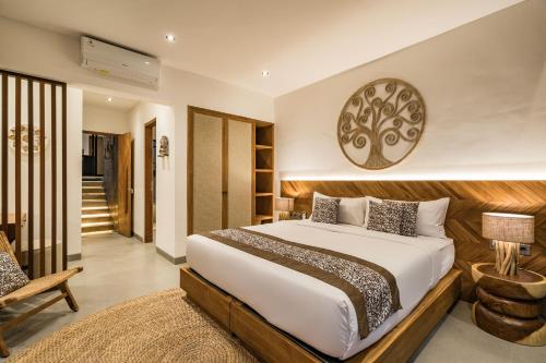 a bedroom with a large bed in a room at Villa Kemalasan by BaliSuperHost in Ubud