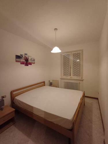 a bedroom with a large bed in a room at Fiore in Pieve Di Ledro