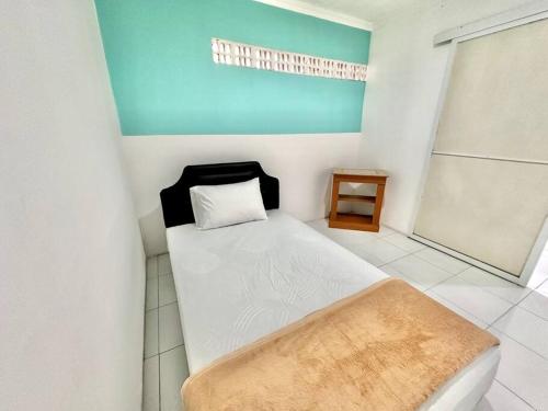 Ένα ή περισσότερα κρεβάτια σε δωμάτιο στο Omah Lestari