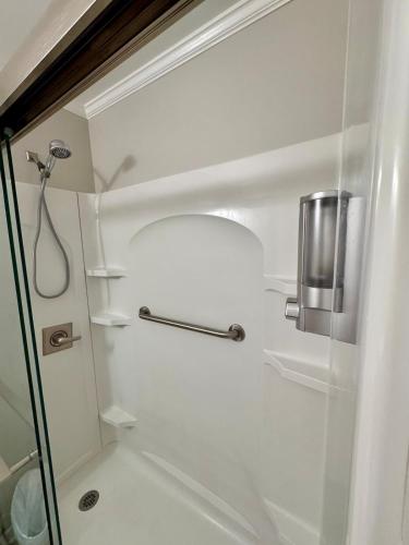 a bathroom with a shower with a glass door at Apartment in Lexington, SC in Lexington