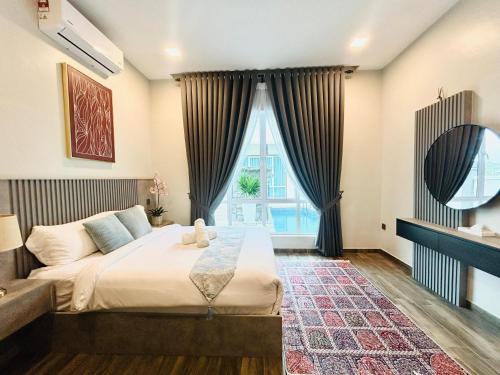 a bedroom with a bed and a large window at Tijami Villa & Resort in Kampong Mangkok