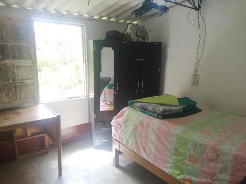 Llit o llits en una habitació de Ermita del tinte