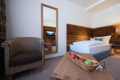 Tempat tidur dalam kamar di Boutique Hotel Herzhof - Garni-Appartements - Adults Only