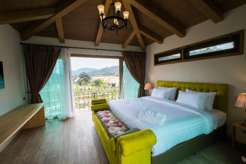 Ένα ή περισσότερα κρεβάτια σε δωμάτιο στο Mela Garden Retreat Cottage