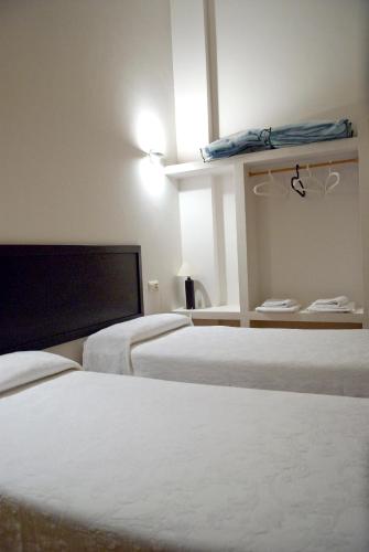Ένα ή περισσότερα κρεβάτια σε δωμάτιο στο Casa do Comediante