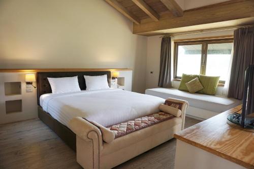 Ένα ή περισσότερα κρεβάτια σε δωμάτιο στο Mela Garden Retreat Cottage