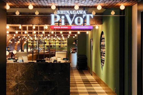 a restaurant with a bar and a sign that reads pvd at Shinagawa Prince Hotel East Tower in Tokyo