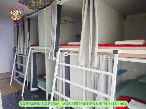 a group of bunk beds in a dorm room at The Funky Monkey Hostel - 18 to 40 years old only in Haad Rin