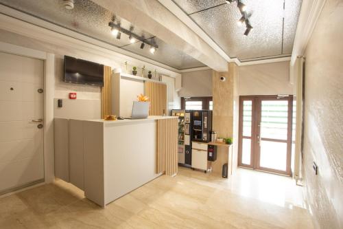 a kitchen with a counter in a room at Crystal Luxury in Craiova