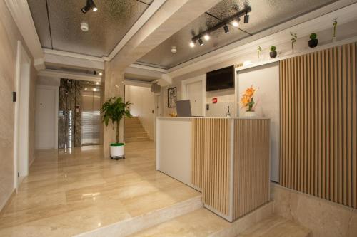 a large room with a lobby with a counter at Crystal Luxury in Craiova