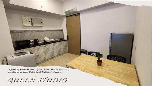 a room with a table and a toilet in a room at Revo Aurora Place Bukit Jalil in Kuala Lumpur