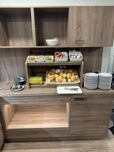 a table with food on top of it at Hotel Am Vogelsanger Weg in Düsseldorf