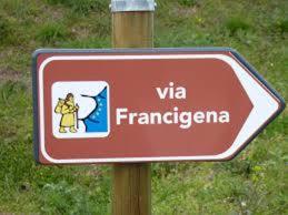 a red sign on a wooden pole in a field at Etruria Life in Sutri