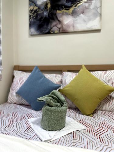 Ένα ή περισσότερα κρεβάτια σε δωμάτιο στο Condo in Dumaguete City
