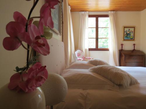 Ένα ή περισσότερα κρεβάτια σε δωμάτιο στο Le Jardin