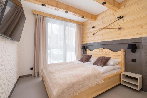 Postel nebo postele na pokoji v ubytování SnowHill Apartment by Rent like home
