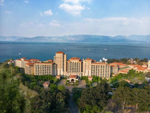 an aerial view of a resort near the water at Hilton Yuxi Fuxian Lake in Chengjiang