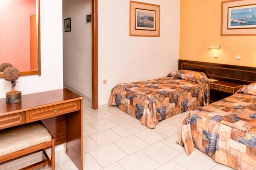 Postel nebo postele na pokoji v ubytování Aphrodite Apartments