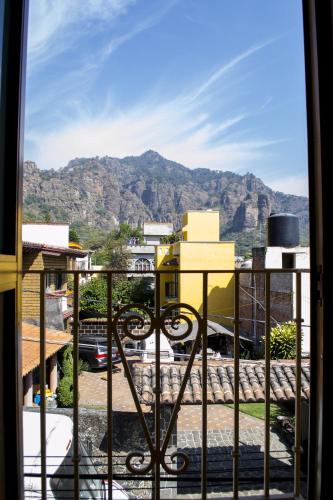 a view of a mountain from a balcony at La Ventana del Tepozteco in Tepoztlán
