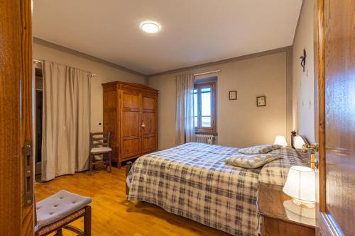 Postel nebo postele na pokoji v ubytování Il Gugnolo - Casale in Val d'Orcia