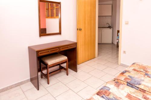 Postel nebo postele na pokoji v ubytování Aphrodite Apartments