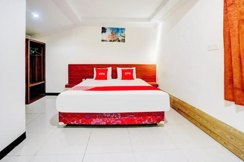Ένα ή περισσότερα κρεβάτια σε δωμάτιο στο Hotel O Siwalankerto Near Surabaya Carnival